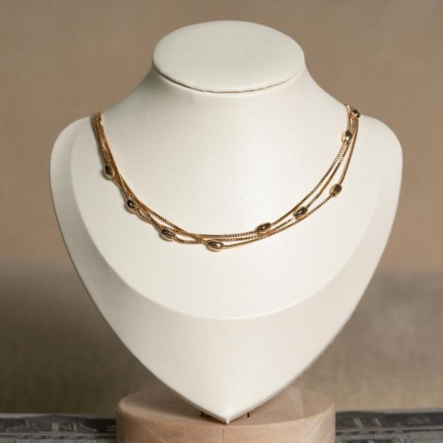 Collar Multicadena Dorada con Balines Ovalados
