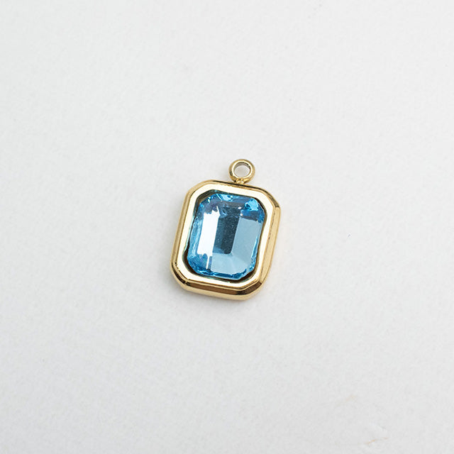 Dije Rectangular con Circonia Celeste y Baño de Oro