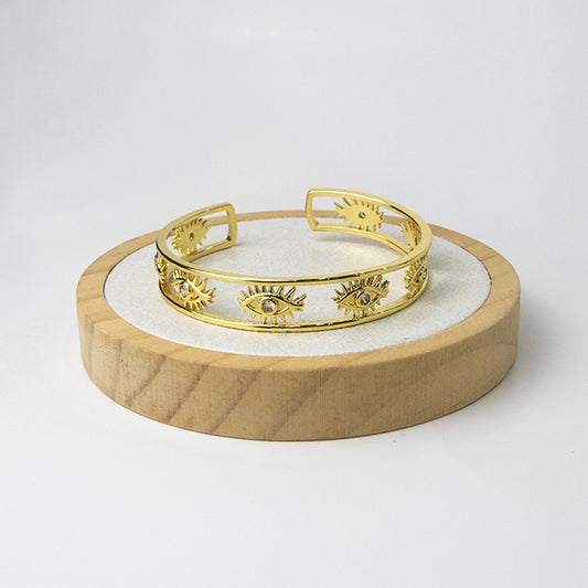 Pulsera Cuff Ojos Protectores Dorada