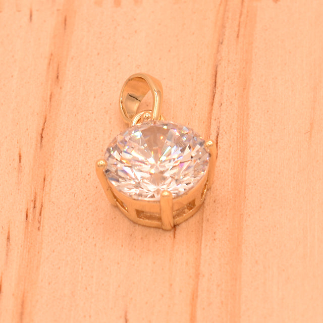 Dije Brillante con Piedra Transparente y Baño de Oro