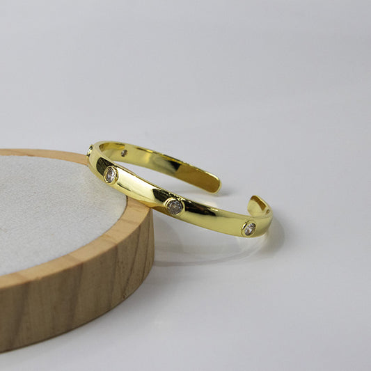 Brazalete Rígido Dorado con Circonitas